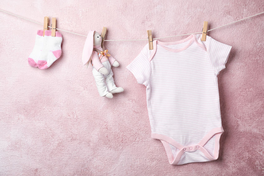 baby clothes hanging on wire
